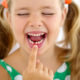 Little girl pointing to her missing tooth