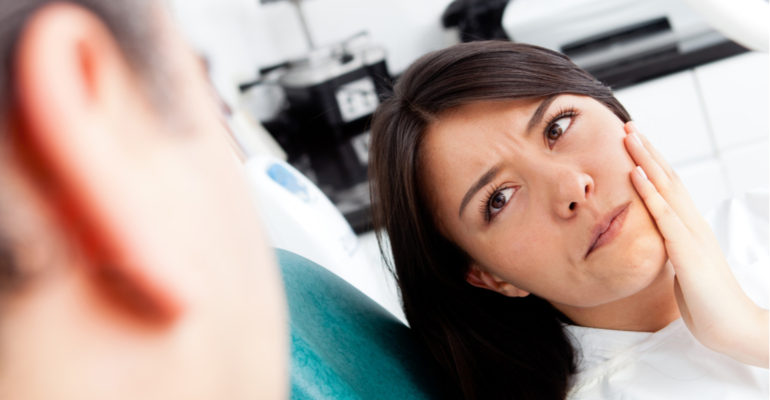 women at dentist for root canal