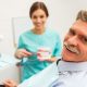 patient at dentist office | dental implants | replacing missing teeth