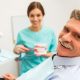 Patient with hygienist discussing gum disease
