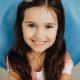 pediatric dentist | Little girl smiling at camera.