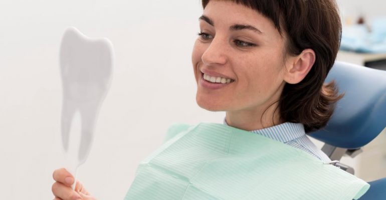 Dental Fillings | Dental patient looking at mirror