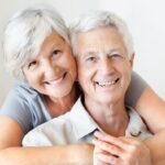 dental implants | older couple smiling