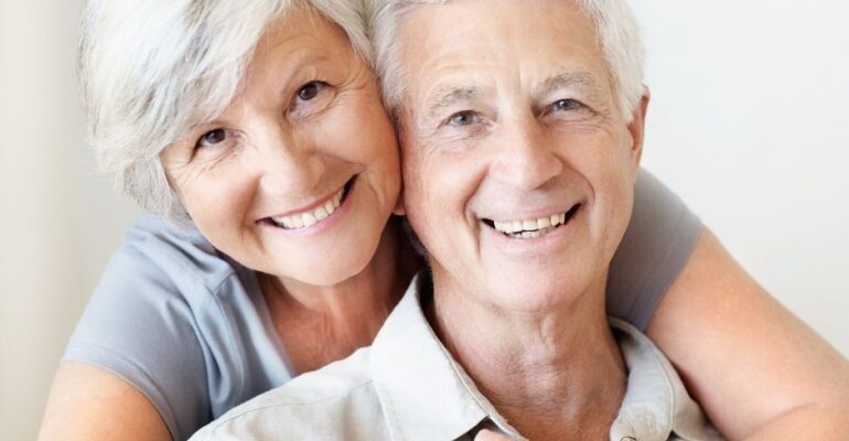 dental implants | older couple smiling